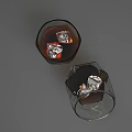 Two Wine Glasses One Upright One Tilted with Brown Liquid Ice Cubes on Gray Background