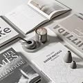 Stylish Books and Magazines Display With Open Pages Coffee Cup and Decorative Objects