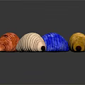 Colorful Textured Caterpillars in Red Brown Blue White and Yellow on Dark Background