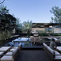 Serene Modern Garden Landscape With Lush Trees Water Pool Reflection And Outdoor Seating