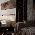 Cozy Bedroom Interior With Rattan Headboard Wooden Wall Art Bedside Lamp And Layered Bedding