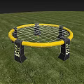 Yellow Circular Spark Tube Play Equipment on Green Grass with Black Supports