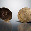 Two Metallic Ancient Shields With Ornate Studs And Decorative Patterns As Historical Weapon
