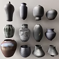Assorted Dark Toned Ceramic Vessels With Various Shapes And Textured Surfaces