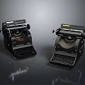 Two Black Remington Vintage Typewriters Displayed As Classic Electronic Appliances On Dark Reflective Surface