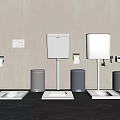 Three Modern Toilets White Cisterns Gray Bins Toilet Paper Holders Light Gray Wall Dark Floor