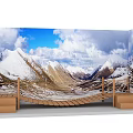 Wooden Suspension Bridge With Snowy Mountains And Blue Sky Overlooking Scenic Mountain Landscape