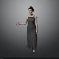 Elegant Woman In Patterned Long Dress Standing With Extended Arm On Gray Background