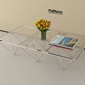 Poliform Modern Transparent Glass Coffee Table With Geometric Metal Frame Yellow Tulips And Magazine