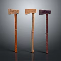 Three Traditional Wooden Axes With Different Colored Handles And Textures