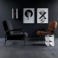 Stylish Black And Brown Accent Chairs With Dark Wall Framed Artworks And Side Table