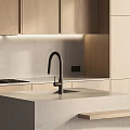 Modern Kitchen With Light Wood Cabinets Concrete Island Built In Oven And Under Cabinet Lighting