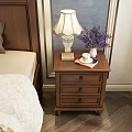 Brown Wooden Nightstand With Fringed Table Lamp Purple Flower Vase And Three Drawers