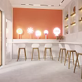 Modern Milk Tea Shop Interior With Orange Walls Arched Shelves White Bar Stools Golden Legs