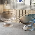 Two Modern Transparent Leisure Chairs With Streamlined Design And Stable Base 3d model
