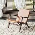 Modern Tan Leather Leisure Chair With Wooden Frame On Geometric Pattern Rug In Bright Room