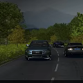 Cars Driving On Scenic Road With Green Trees And Distant Mountains