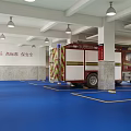Red Fire Truck Parked On Blue Floor With White Pillars Yellow Seats And White Ceiling