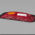 Packaged Fresh Raw Red Meat In Black Tray With Red Yellow Label Text