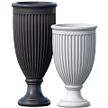 Decorative Ornament Set Featuring Black And White Fluted Vases With Pedestal Bases