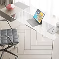 Modern Glass Desk With Laptop Coffee Cup And Black Office Chair By Window