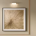 Gold Abstract Oil Painting with Radiant Texture in Black Frame on Beige Wall and Wall Light