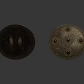 Two Metallic Ancient Shields With Ornate Studs And Decorative Patterns As Historical Weapon
