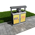 Outdoor Public Trash Bin With Yellow Doors On Stone Pavement Beside Green Grass And Signs