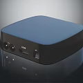 Compact Streaming Device With Blue Top Black Body Featuring HDMI Port Control Buttons