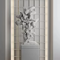 Abstract Silver Sculpture with Unique Curved Shapes on Pedestal Against Lattice Screen Background