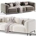 Elegant Modern Sofa In Neutral Colors With Decorative Pillows And Cozy Throw Blanket