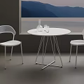 Modern Café Interior With Round White Table White Chairs Glass Bottle And Mountain Lake Painting