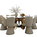 Modern Beige Dining Set with Round Table Curved Back Chairs Vase Branches and Fruit Bowl