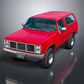 Red Vintage SUV with Classic Front Grille and Rugged Off Road Tires