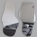 Modern Lighted Wavy Mirror Reflecting Gray Sofa In Living Room