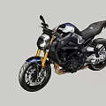 Black Sporty Motorcycle With Golden Accents Against Mountain Forest And Blue Sky