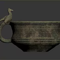 Ancient Bronze Sculpted Bowl With Bird Shaped Handle And Intricate Patterns