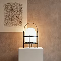 Modern Table Lamp With Black Metal Frame And White Round Lampshade On White Base