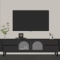 Modern Black TV Stand With Decorative Vase Photo Frame And Speakers In Living Room