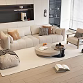 Modern Beige Sofa and Round Coffee Table Set with Pillows Armchair Rug and Natural Light
