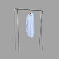 Light Blue Shirt Hanging On Modern Metal Clothes Rack For