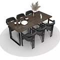 Modern Dining Table Set with Dark Chairs Wine Bottles Bowl and Feather Decor