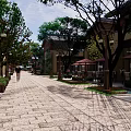 Commercial Landscape Design Featuring Modern Buildings Lush Greenery Water Pond And Stone Paths