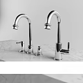 Sleek Modern Chrome Kitchen Faucets on Polished Marble Countertop with Handles