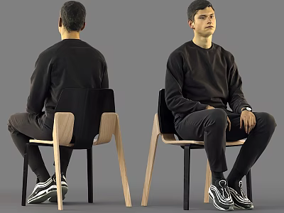 Man In Black Sweatshirt Pants And Sneakers Sitting On Chair 3d model