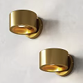 Two Golden Modern Wall Sconces With Warm Light On Light Colored Wall 3d model