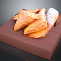 Freshly Baked Flaky Pastry Snacks Triangular and Rolled Arranged on Wooden Tray