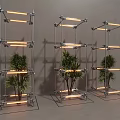 Three Modern Metal Frame Columns With Illuminated Plants And Glass Base Design