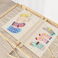 Colorful Patterned Socks Laid Out On Wooden Drying Rack With Mesh Cloth