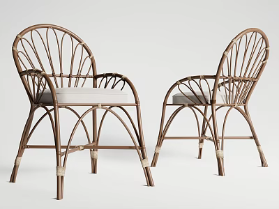 Elegant Rattan Leisure Chairs With Curved Frame And Light Colored Cushions 3d model